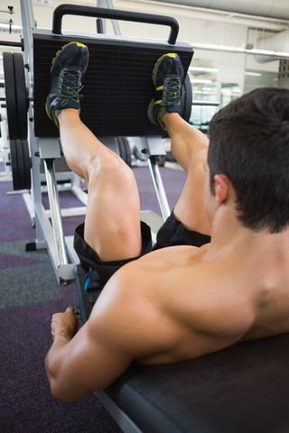 Gym Member Using The Leg Press Machine